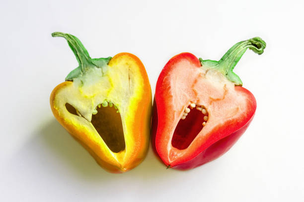 istock pepper yellow and red Bulgarian, two parts, close 995016868