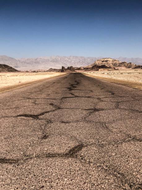 istock Broken road in the Negev Desert 995017036