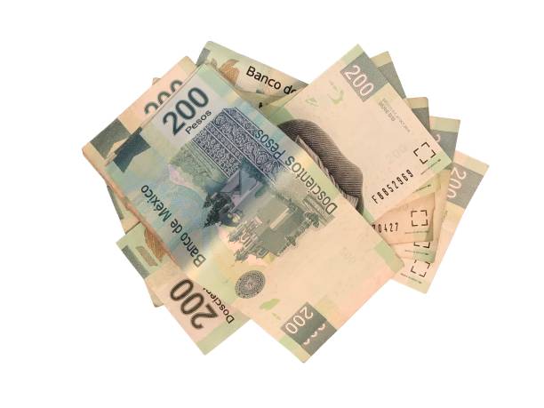 istock Some mexican peso 200 paper bills grouped and isolated on white background 995038812