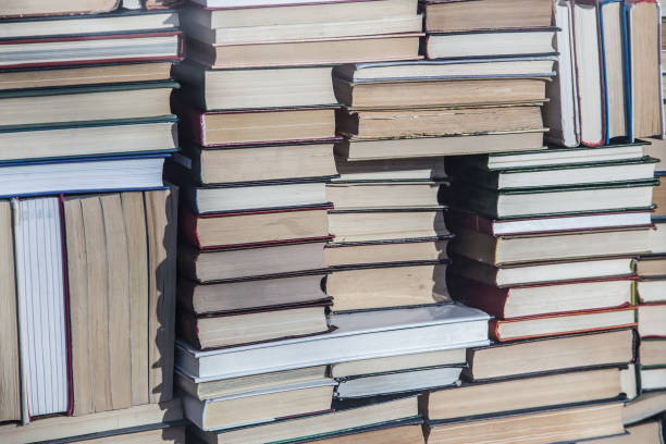 istock lots of books in abstract stacks. 995038826