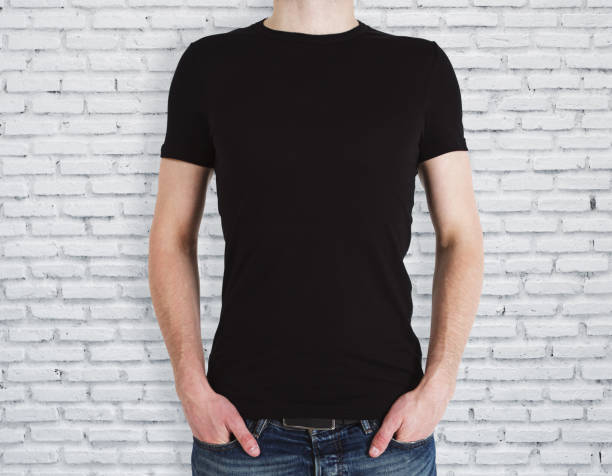 istock Man wearing black shirt on brick background 995038928