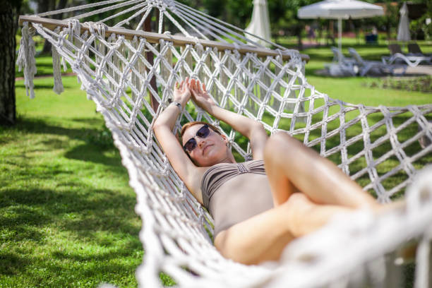 istock Girl in a hammock 995043318
