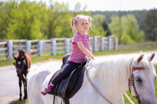 istock Girl and a horse 995064580