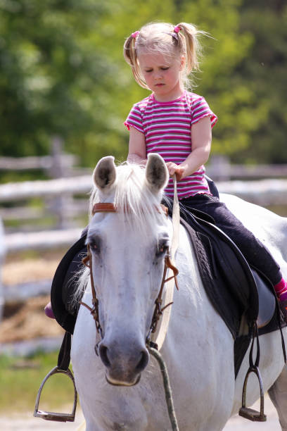 istock Girl and a horse 995064582