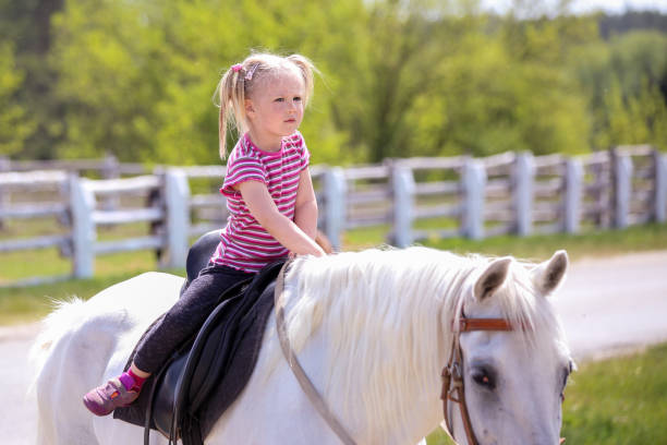 istock Girl and a horse 995064584