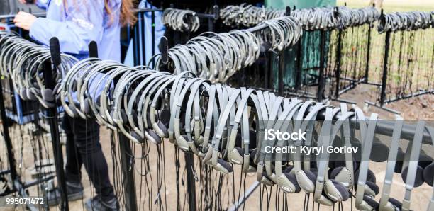 Pile Of Headphones Stock Photo - Download Image Now - Museum, Guide - Occupation, Audio Equipment