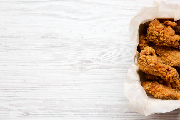 istock Tasty fried chicken wings, from above. Top view, overhead. Copy space. 995076382