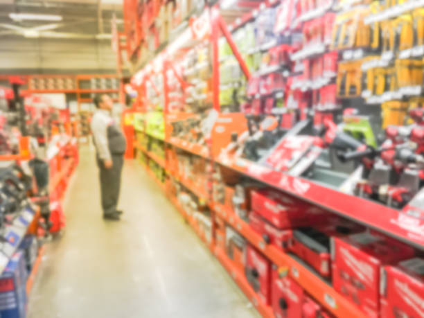 istock Abstract blurred power tool combo kits and customer shopping 995076642
