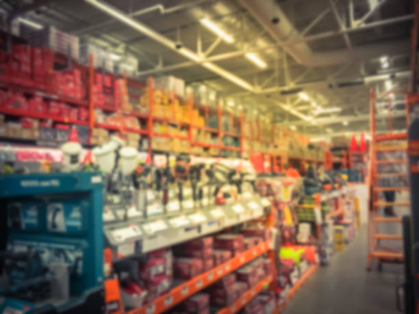 istock Vintage blurred power tool combo kits at hardware store in America 995076768