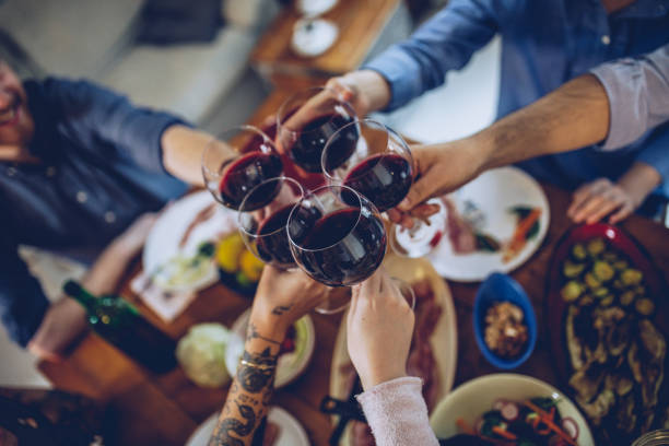 istock Group of friends drinking red wine 995102518