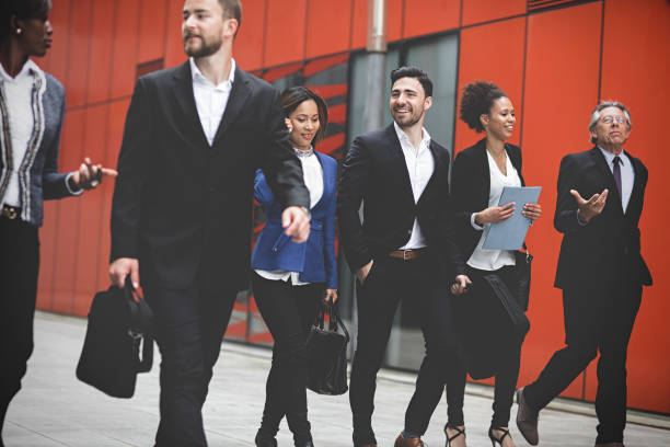 istock Business people walking downtown business district 995104882