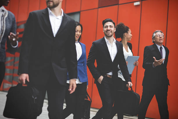 istock Business people walking downtown business district 995104942