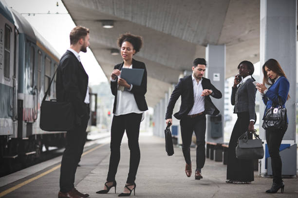 istock Young Businessman trying to catch the train 995107254