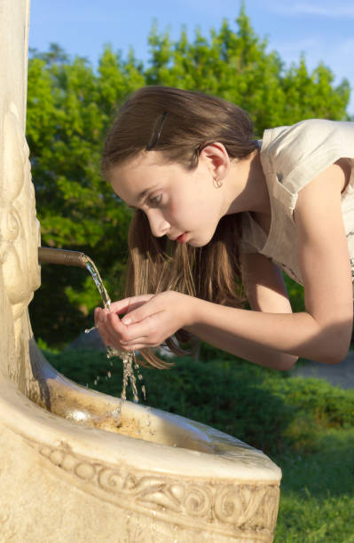istock Young girl drinking water 995116610
