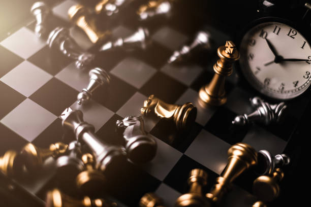 istock business strategy ideas concept with chess board game drama light filter tone on black background 995117302