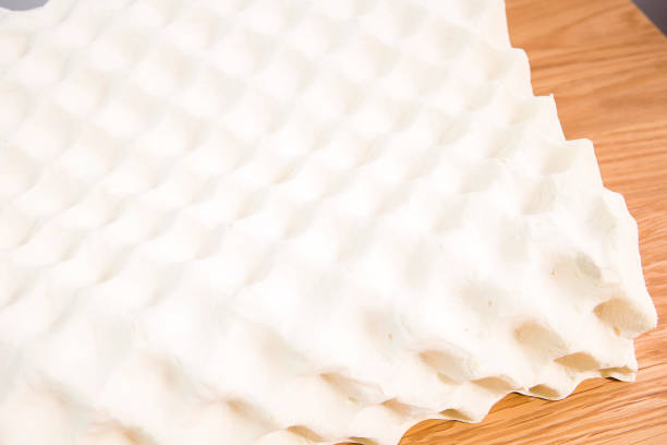 istock White latex pillow, very comfortable to sleep, brown background 995133482