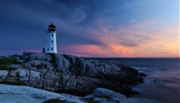 istock Peggy's Cove lighthouse at dusk 995136096