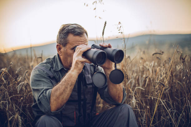 istock Senior farm worker examining wheat crops field 995138574