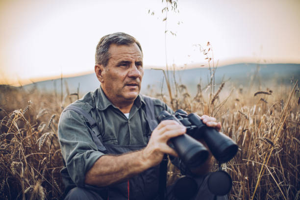 istock Senior farm worker examining wheat crops field 995138744