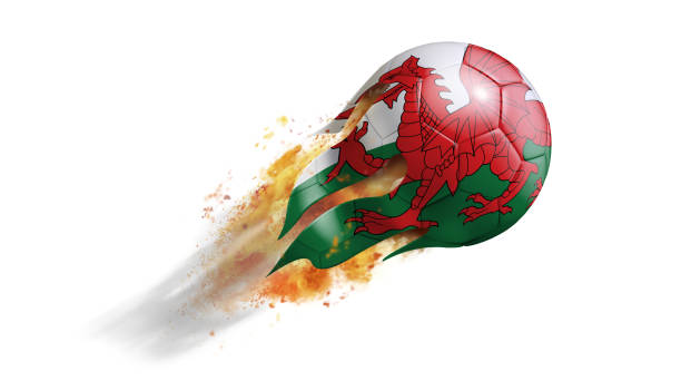летающий пылающий футбольный мяч с флагом уэльса - cymry стоковые фото и изображения