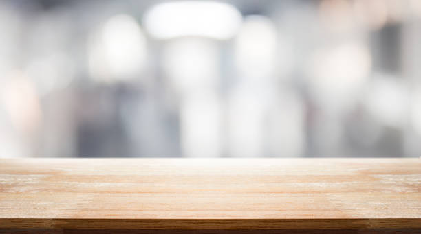istock Empty wood table on department store blur background / Defocused blur background / can be used for display your product 995149102