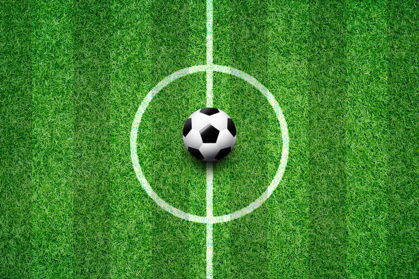istock soccer field center and ball top view background 995203656
