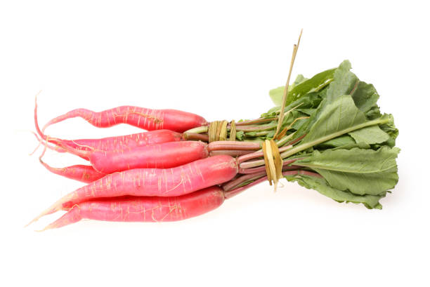 istock Long red radish with leaves on white background 995206382