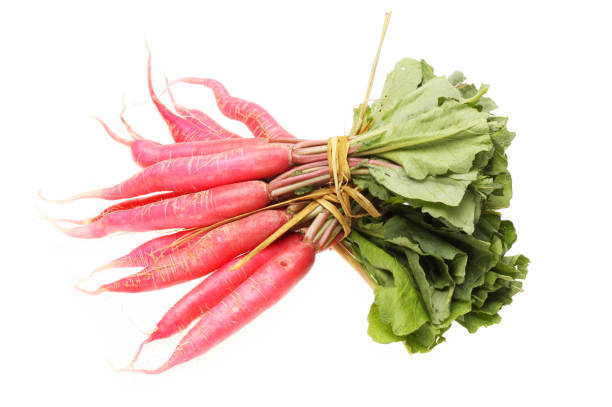 istock Long red radish with leaves on white background 995206404
