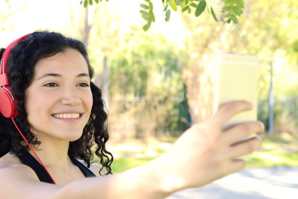 istock Latin woman making selfie. 995228330