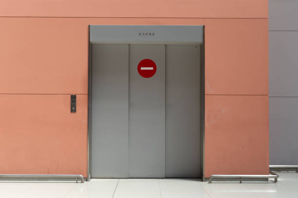 istock sidewalk by street wall & door 995238730
