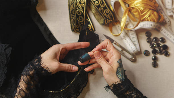 istock Girl sews a dress 995238980