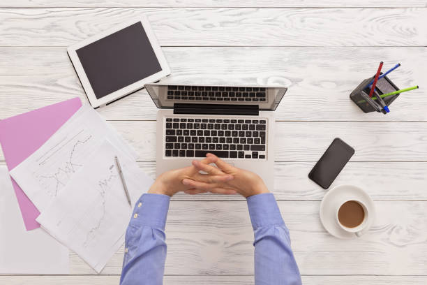 istock Top View Of The Office Table And Resting Hands 995241718