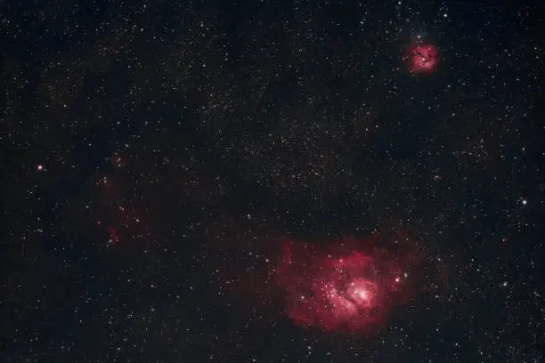 The Lagoon Nebula and the Trifid Nebula in the constellation Sagittarius as seen from Mannheim in Germany.