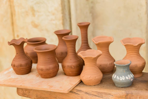 istock different clay pots on a wooden table 995244940