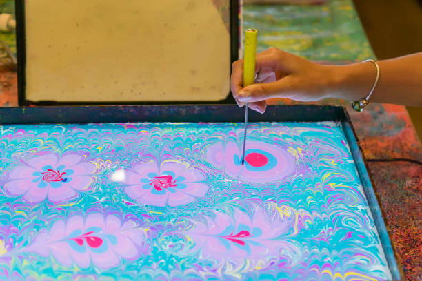 istock Process of creating drawing in ebru technique. Painting on the water 995247330