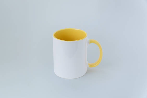 istock A white mug with yellow center 995260820