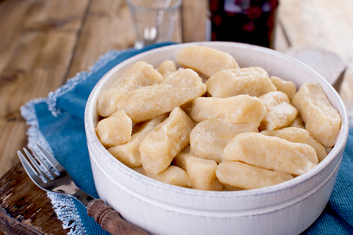 Homemade dumplings with cheese and vanilla. In a rustic style, in a ceramic cup. Healthy vegetarian food. Home cooking. Russian kitchen