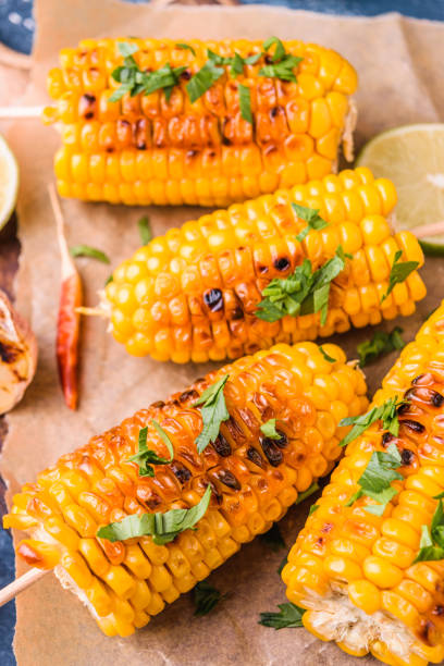 istock Grilled corn cobs  with garlic and pepper 995272922