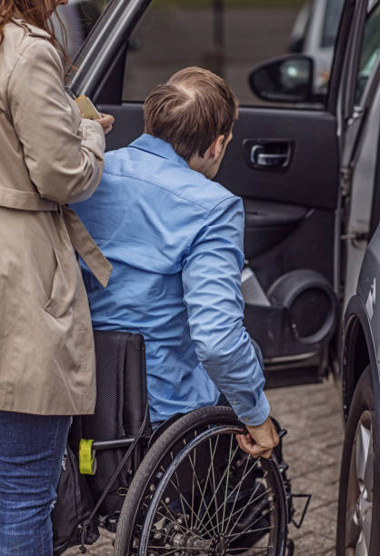 istock Wheelchair using young man and his girlfriend walking together in a restaurant 995295564