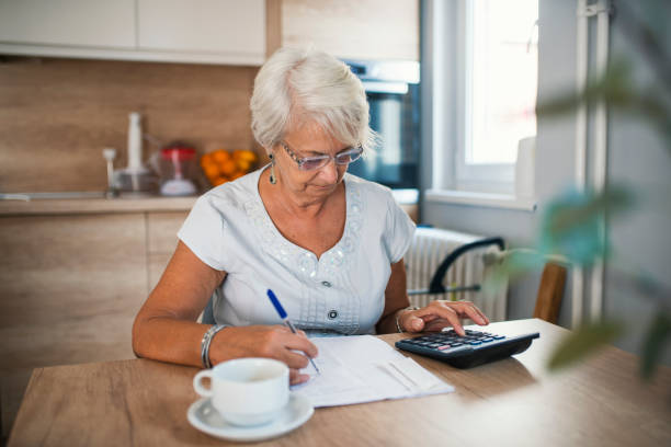 istock Retired woman calculating her domestic bills 995298598