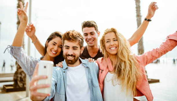 istock taking a selfie all together in the city 995299082