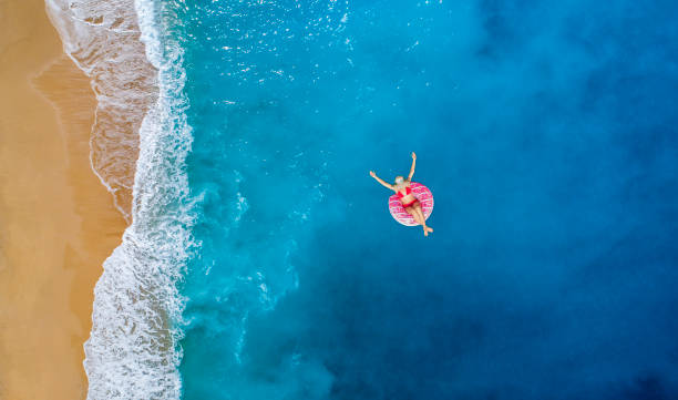 istock Happy sunny day at beach on summer 995299130