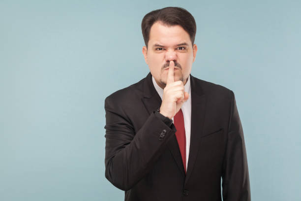 istock Man showing at camera conspiracy sign 995312912