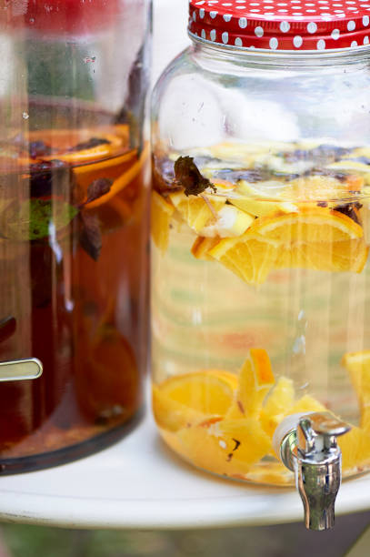 istock Lemonade in a big jar with a tap.Oranges and lemon. Refreshing summer drink 995323180