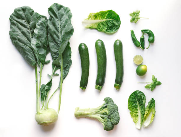 Fresh vegetables on a white background - knolling concept Organic spring vegetables on a white background - knolling concept spring mix lettuce leaves stock pictures, royalty-free photos & images