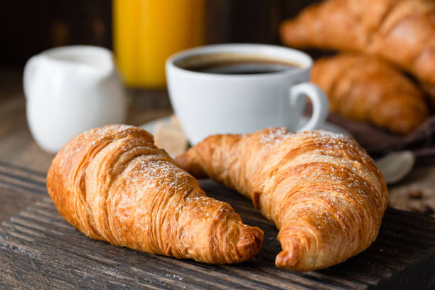 istock Croissants, coffee and orange juice 995329186