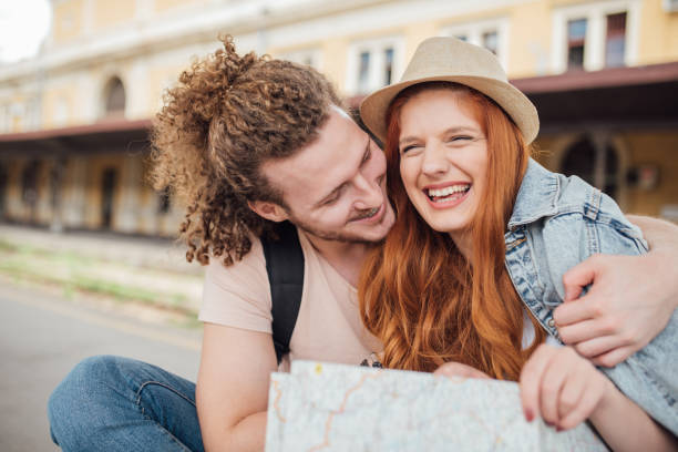 istock Joyful young couple hugging on the train station platform 995347508