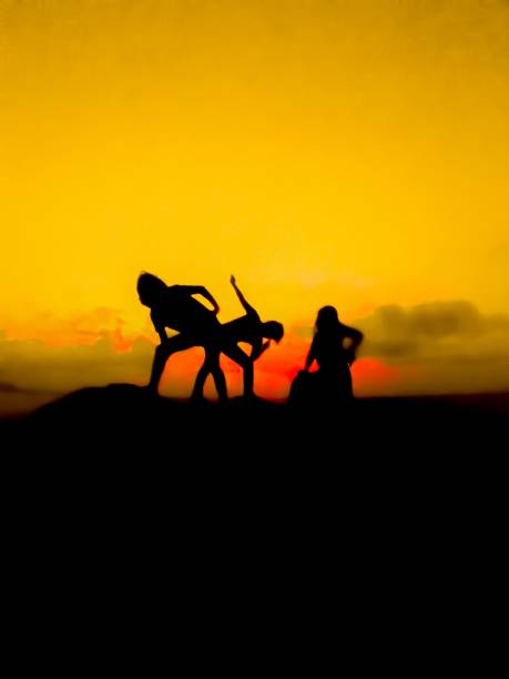 istock three girls look the sunset 995351710