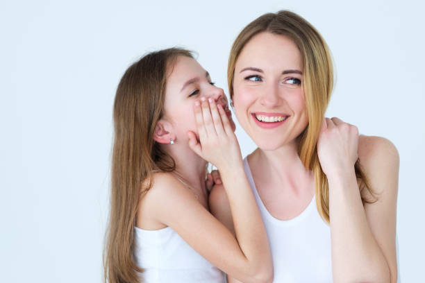 istock parenting loving family relationship whisper 995372396
