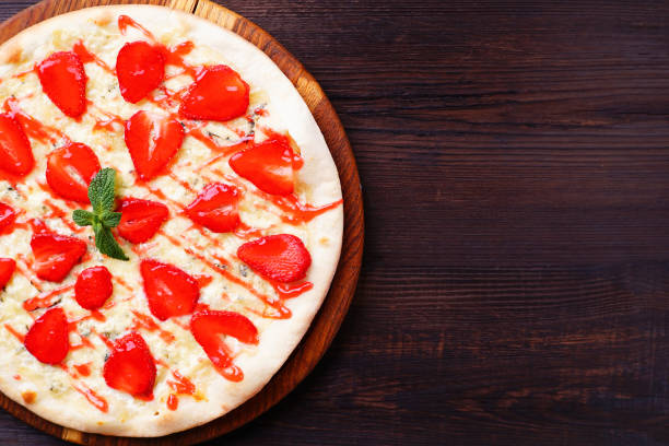 istock strawberry pizza food background 995374552